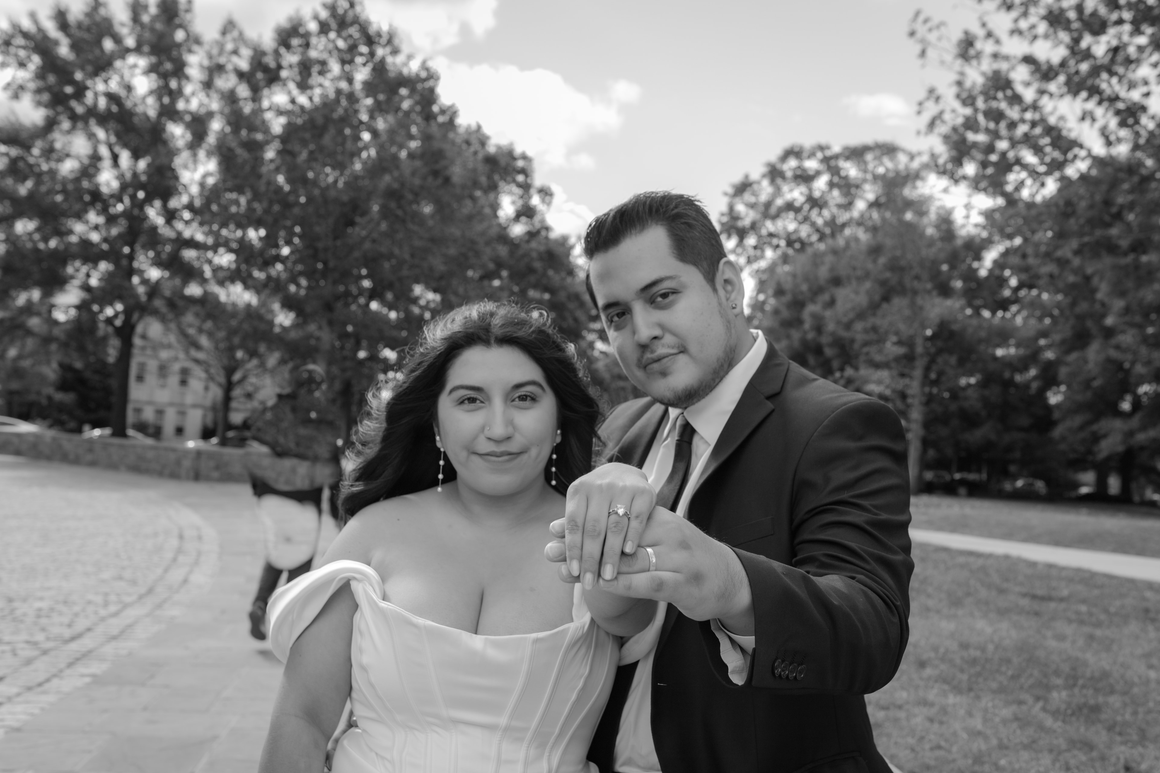 Couple showing their engagement rings